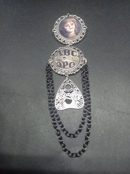 Oddity curiosity  gothic  witchy  Killstar occult " Annabelle inspired double image Ornate Brooch "with spirit board and ouija planchette & chains