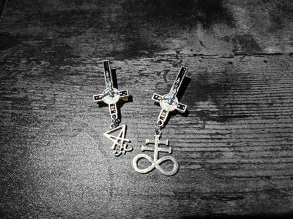 Inverted metal crucifix pin badge with satanic sigils
