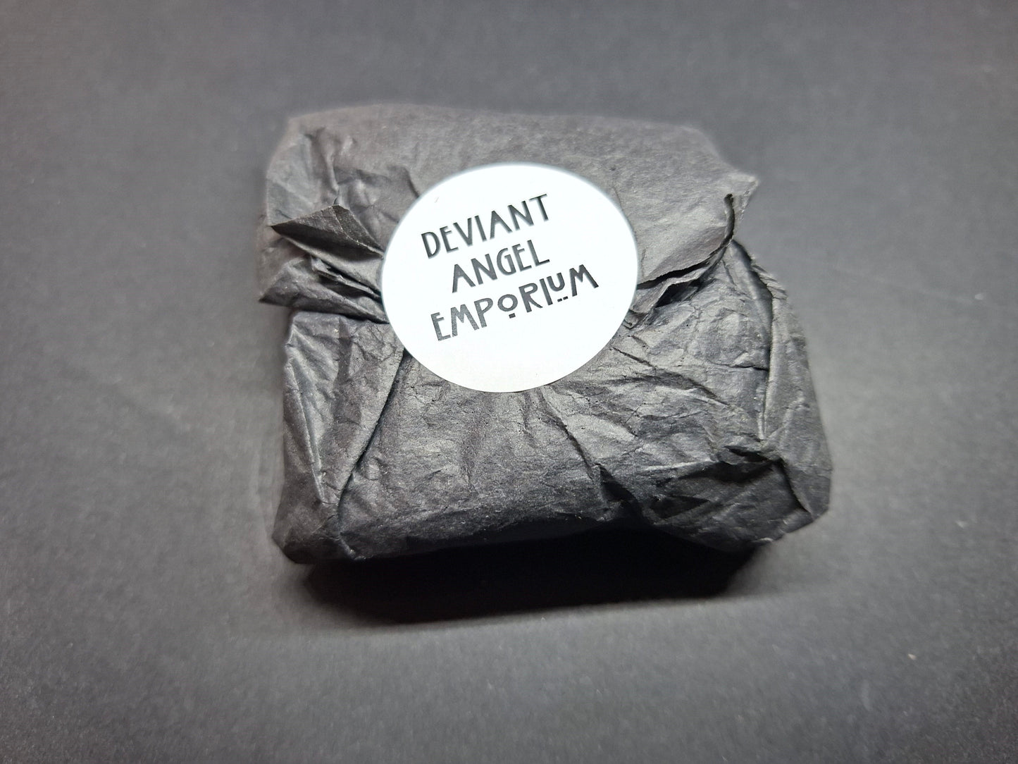 Inverted metal crucifix pin badge with satanic sigils