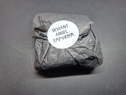 Inverted metal crucifix pin badge with satanic sigils