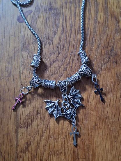 Metal Necklace with bat charm and "Vampire Masquerade ankhs"