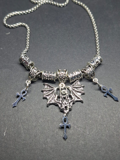 Metal Necklace with bat charm and "Vampire Masquerade ankhs"