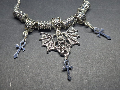 Metal Necklace with bat charm and "Vampire Masquerade ankhs"