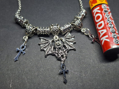 Metal Necklace with bat charm and "Vampire Masquerade ankhs"