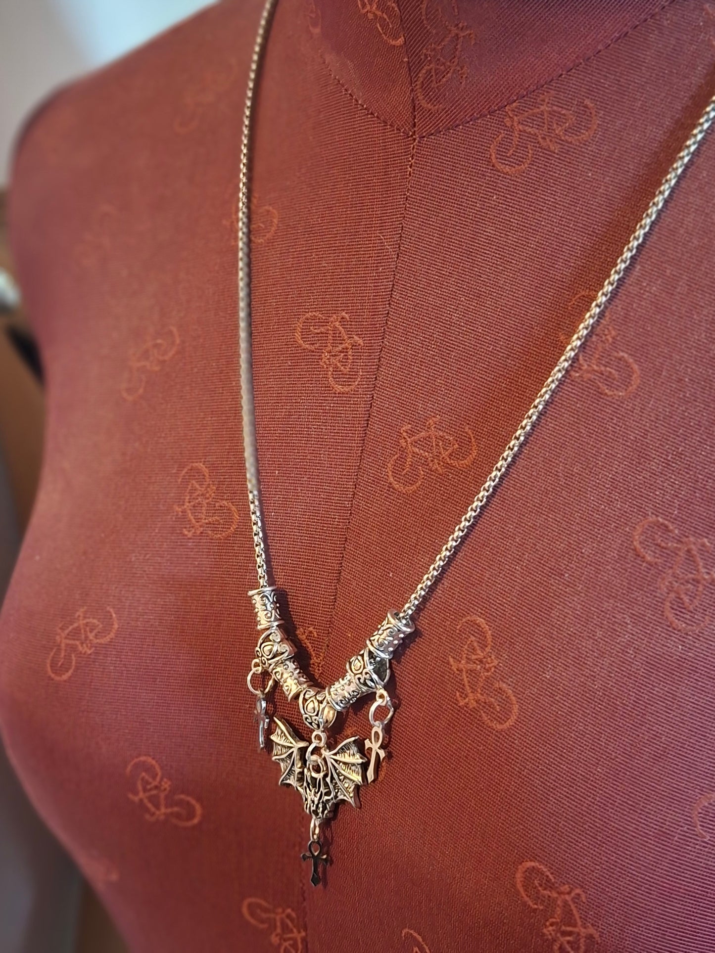 Metal Necklace with bat charm and "Vampire Masquerade ankhs"